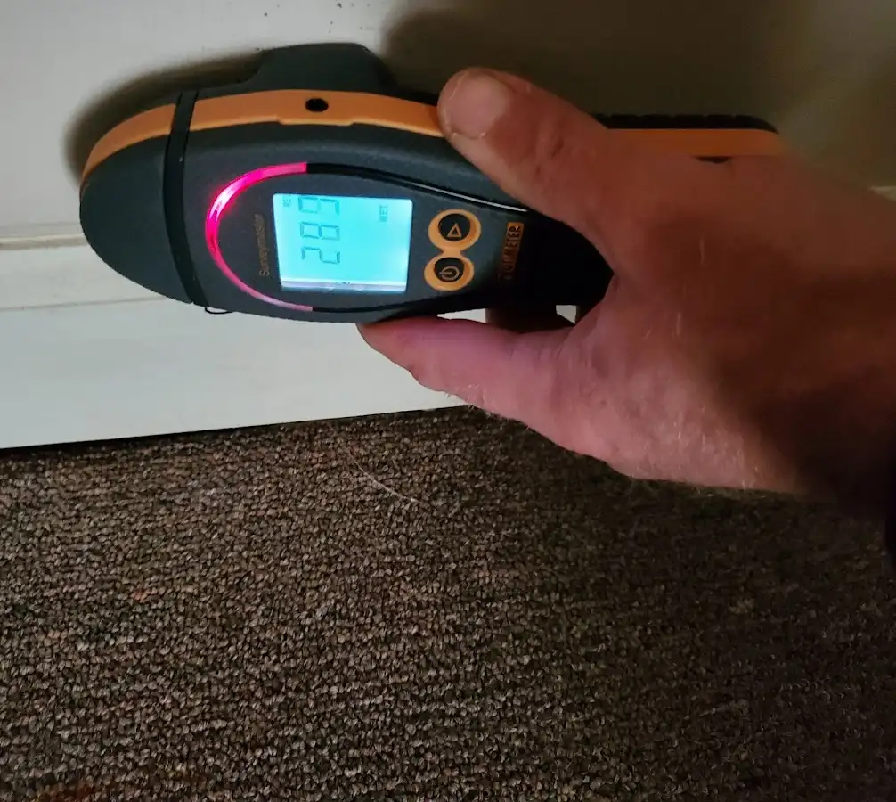 Moisture detection at baseboard during Storm Damage Restoration in Thatcher